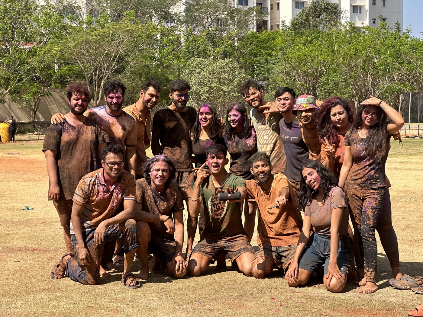 The extended team together outdoors after Holi