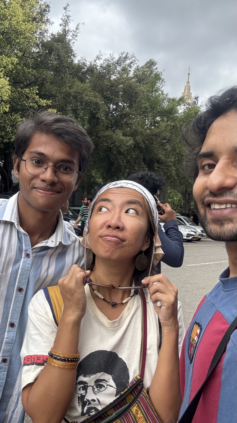 Three team members taking an outdoor selfie